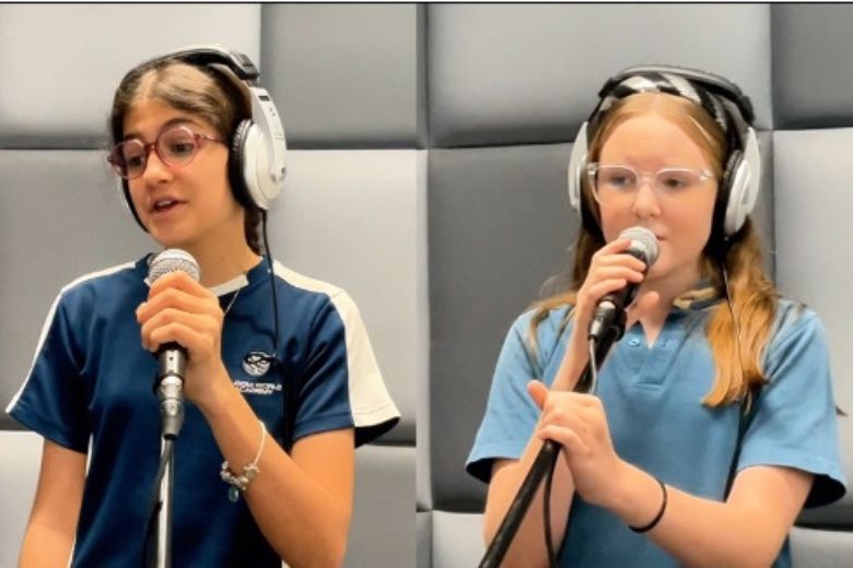 Students recording a musical tribute song in classroom setting