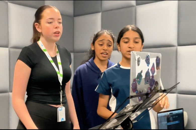 Young students singing Our Home song celebrating safety and cultural harmony