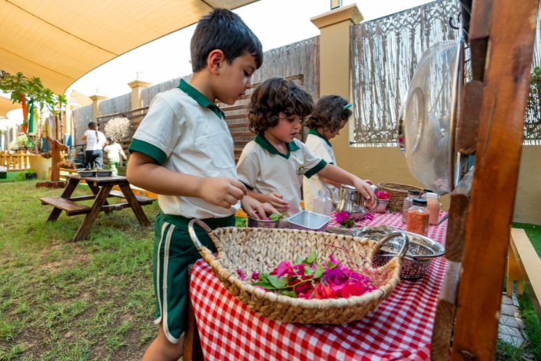 Young children collaborating through hands-on learning and imaginative play during early years activities at Odyssey Nursery