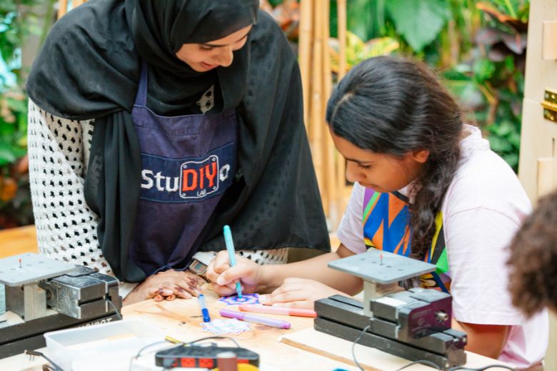 Children enjoying hands-on creative workshops and interactive learning activities in a fun, educational studio space