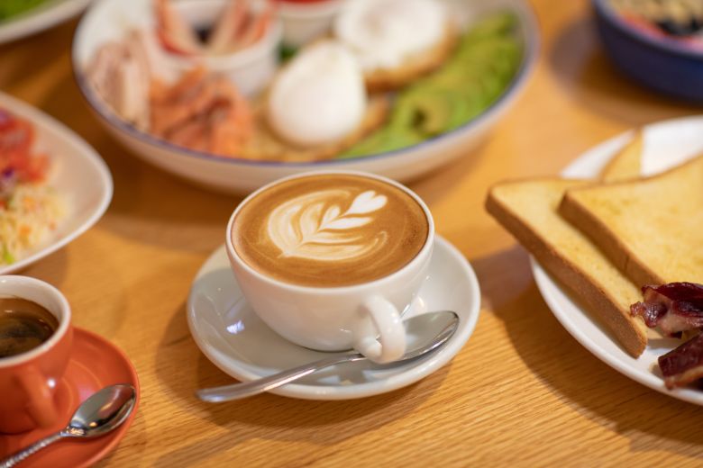 A cosy café setting with freshly brewed coffee and light refreshments, ideal for a relaxing break during shopping or family activities