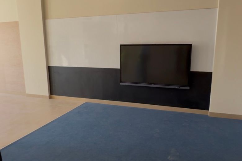 Display boards positioned at the eye level of the children who will use them, one of many details at Ashmount that reflects a building designed around its students rather than its visitors.
