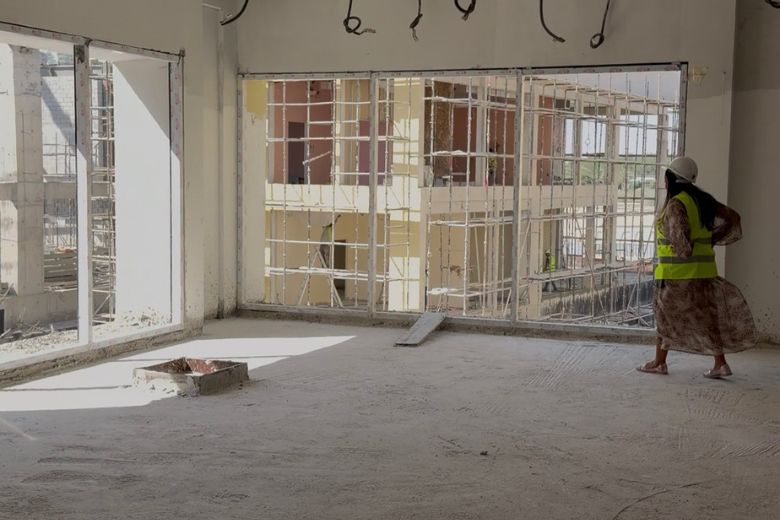 Floor-to-ceiling glazing connects the interior learning spaces to the campus beyond, a design choice that keeps children oriented to the wider world around them.