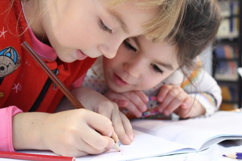 Children collaborate through meaningful play while building communication and social skills