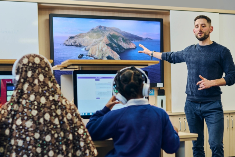 Teachers using curriculum resources during a classroom lesson